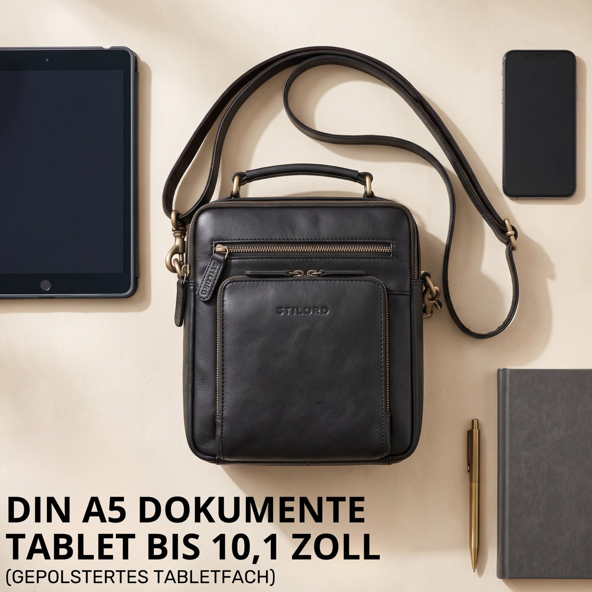 Kleine schwarze Umhängetasche aus Leder mit Henkel, gepolstertes Tabletfach bis 10,1 Zoll, DIN A5, Prägung STILORD sichtbar