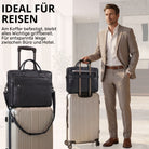 Schwarze Leder-Business-Tasche mit 13–14-Zoll Laptopfach, auf Koffer steckbar, Mann im Anzug neben Koffer
